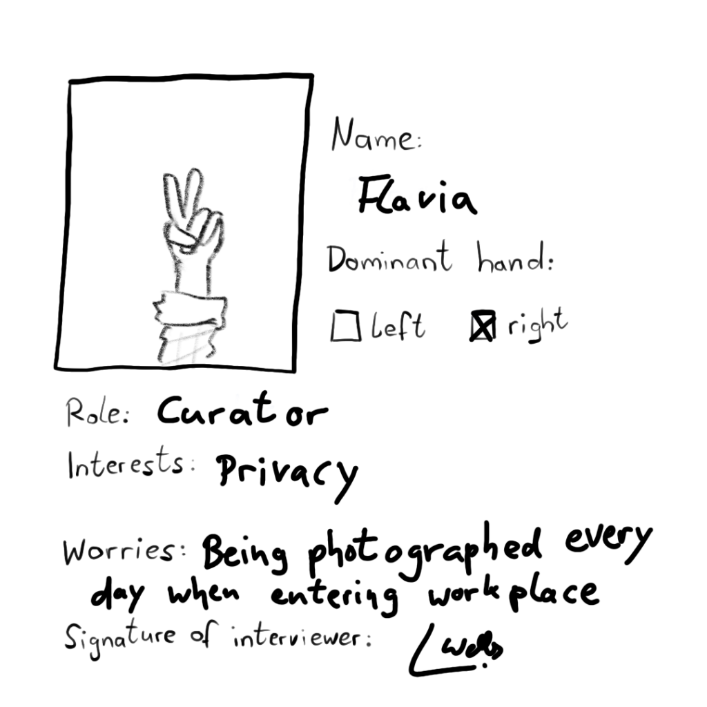 On her photo is only a hand making a peace gesture. Name: Flavia Dominant hand: right Role: curator Interests: privacy Worries: being photographed every day when entering workplace Signature of interviewer: L. Wells